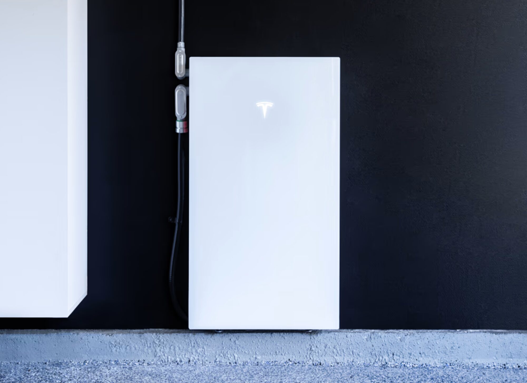 Tesla Powerwall home battery system installed on an exterior wall